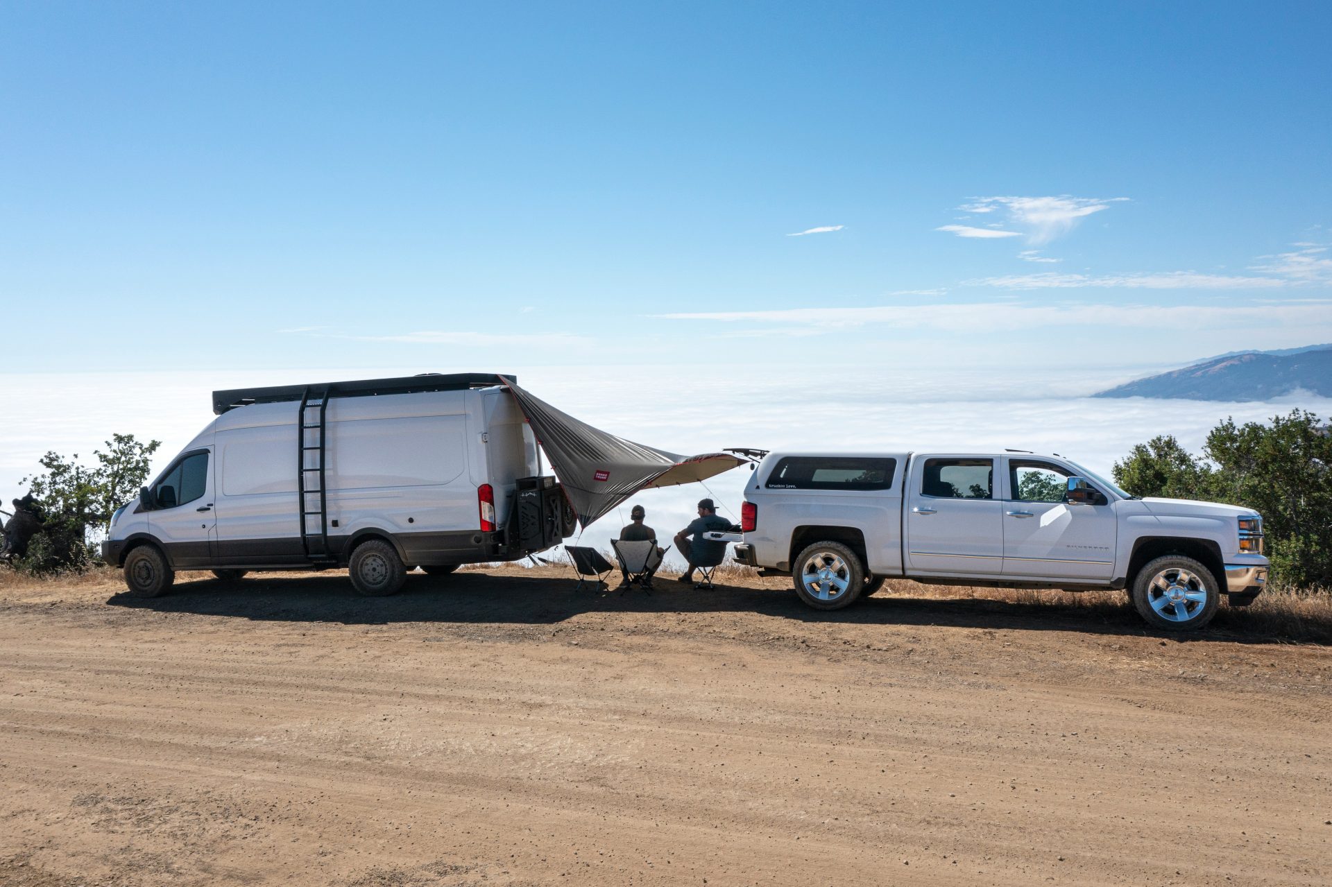 white van on brown sand during daytime